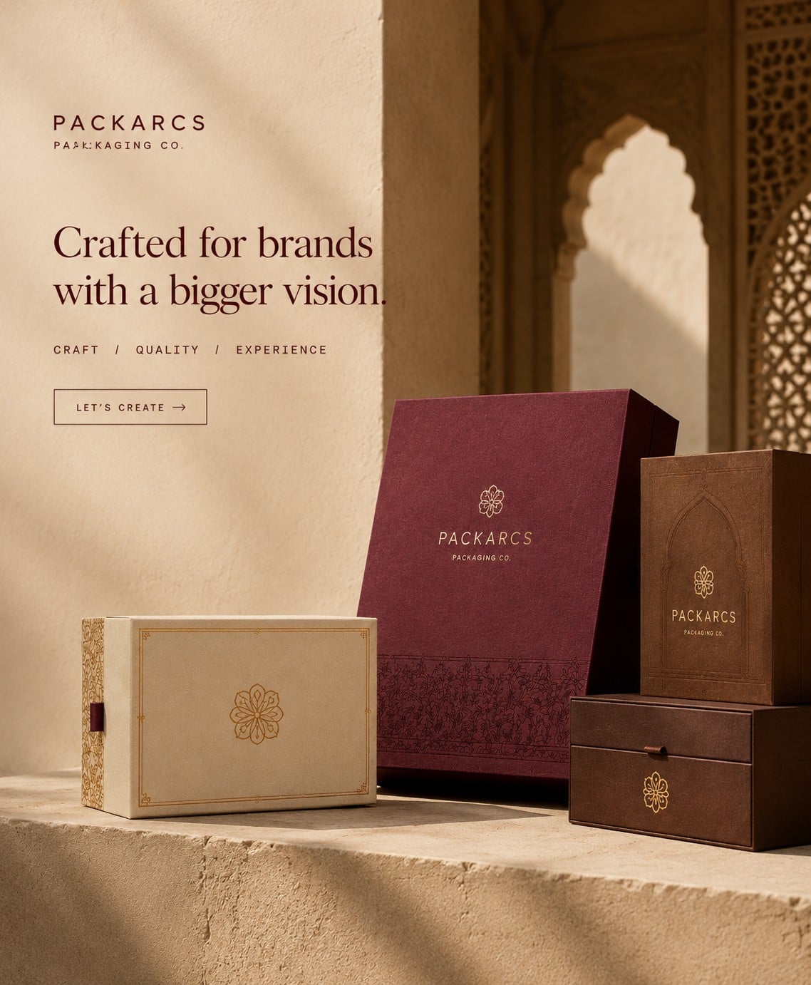 Maroon, cream and brown heritage boxes beneath a carved sandstone arch. Crafted for brands with a bigger vision.