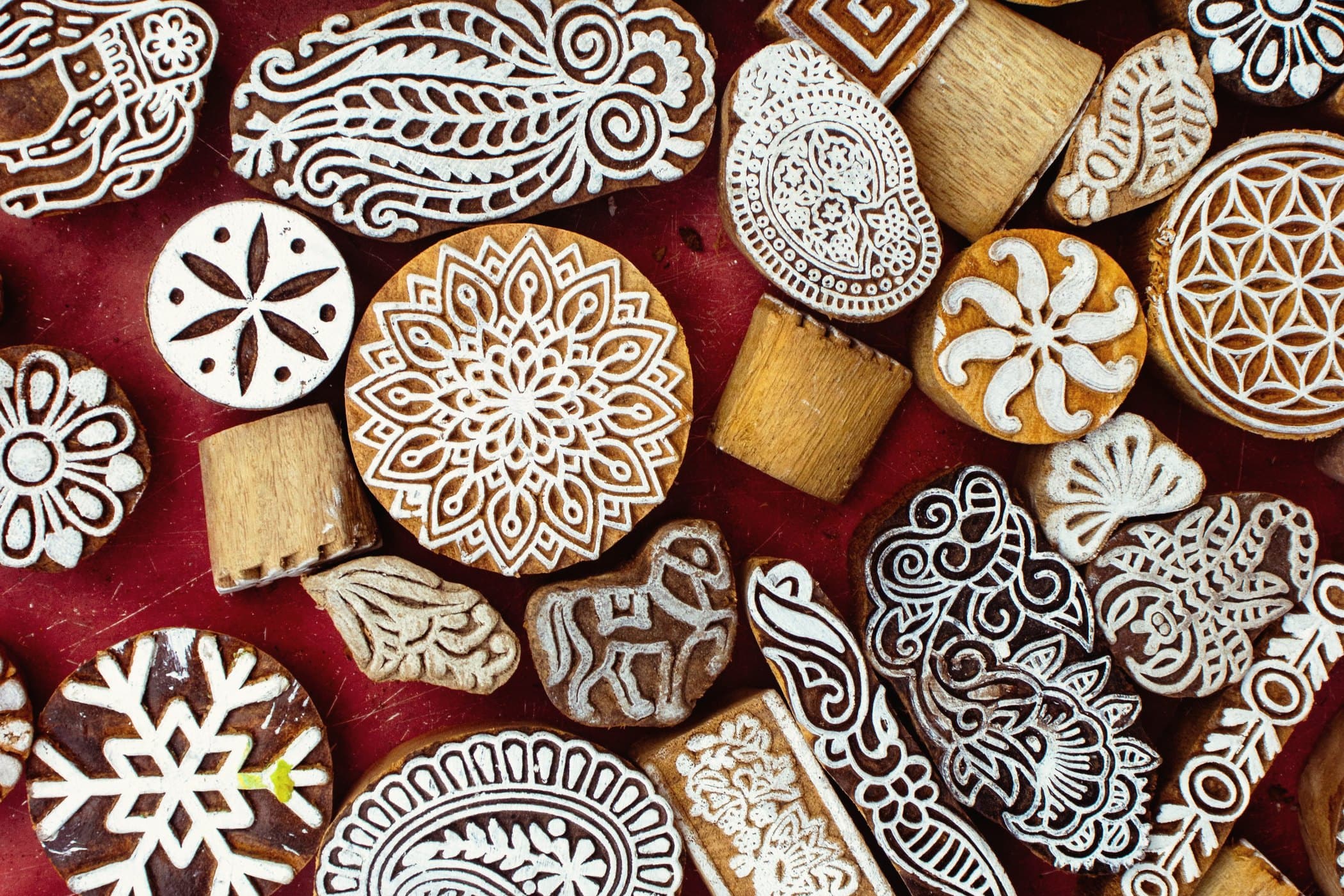 Carved wooden printing blocks resting on hand-printed cotton