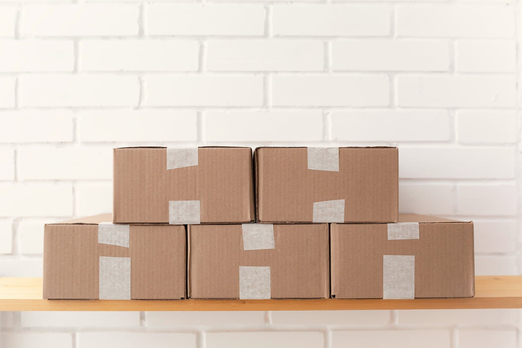 Corrugated shipping cartons taped and stacked, ready to leave